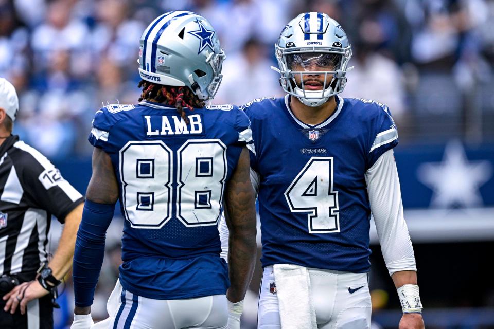 Oct 30, 2022; Arlington, Texas, USA; Dallas Cowboys wide receiver CeeDee Lamb (88) and quarterback Dak Prescott (4) wait for play to resume against the Chicago Bears during the second half at AT&T Stadium. Mandatory Credit: Jerome Miron-USA TODAY Sports ORG XMIT: IMAGN-489313 ORIG FILE ID: 20221030_jpm_an4_005543.JPG