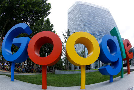 The brand logo of Alphabet Inc's Google is seen outside its office in Beijing, China August 8, 2018. Picture taken with a fisheye lens. REUTERS/Thomas Peter/File Photo