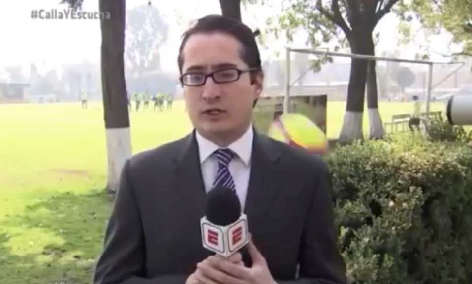 ESPN’s Marcelino Fernandez reports from Club America’s training ground as a ball whizzes past his shoulder. (Screenshot: Twitter)