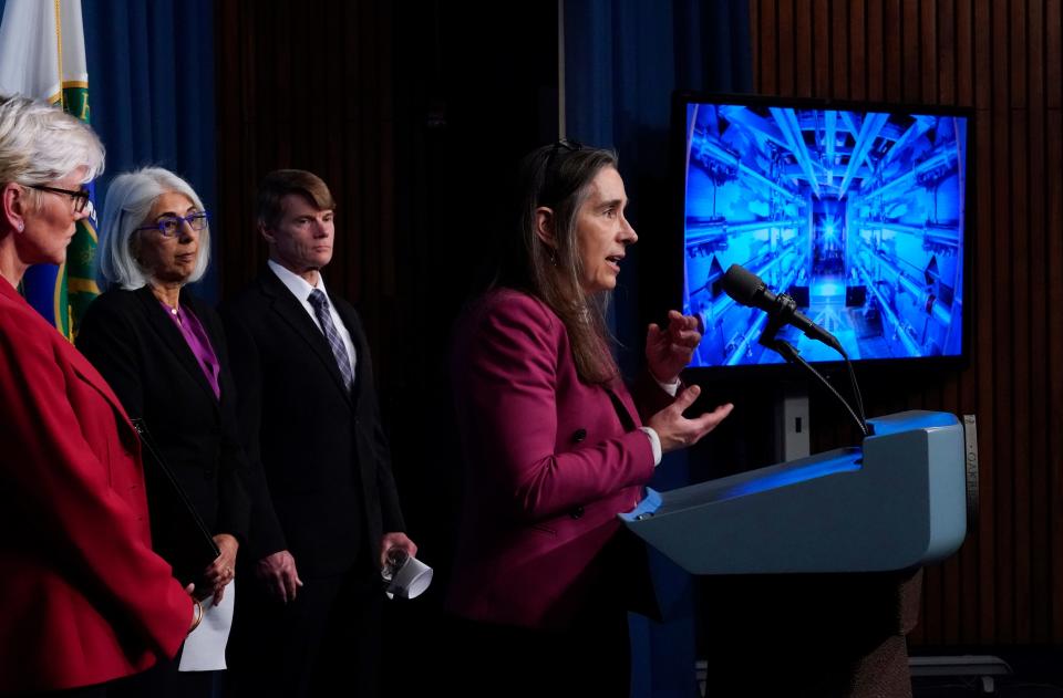 Kim Budil, director of the Lawrence Livermore National Laboratory, center, is joined by, from left, Secretary of Energy Jennifer Granholm, Arati Prabhakar, the president's science adviser, and National Nuclear Security Administration Deputy Administrator for Defense Programs Marvin Adams. Budil discusses a major scientific breakthrough in fusion research that was made at the lab in California, during a news conference at the Department of Energy in Washington on Tuesday.