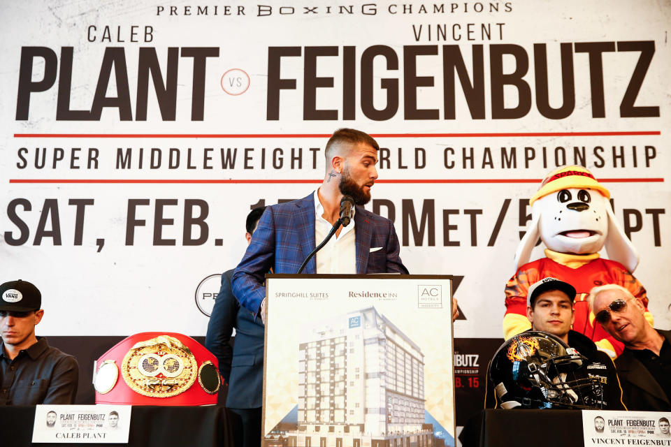 IBF super middleweight world champion Caleb Plant turns to opponent Vincent Feibenbutz during a news conference to promote their title fight on Saturday in Nashville, Tennessee. (Stephanie Trapp/TGB Promotions)