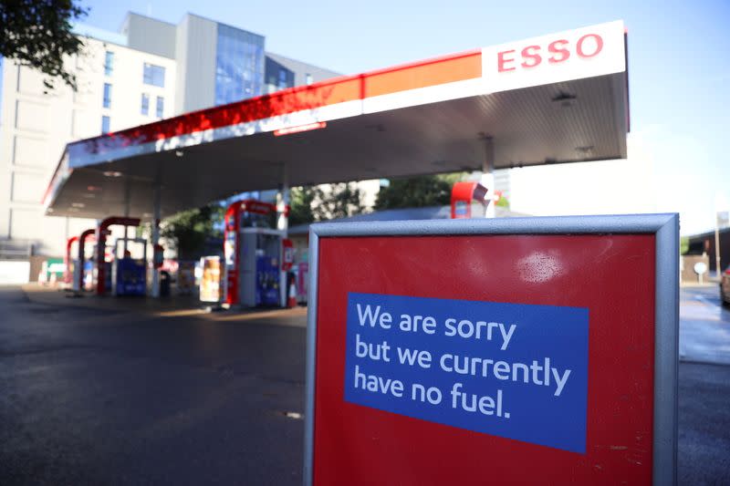 FILE PHOTO: A sign informing customers that fuel has run out is pictured at a Esso fuel station in London