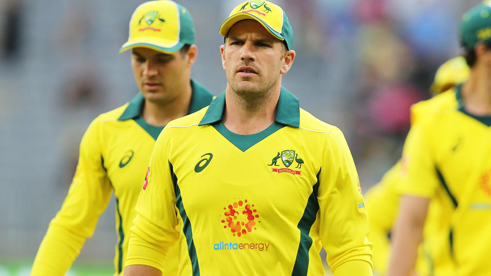 Aaron Finch leads the team from the field after their loss. (Photo by Paul Kane – CA/Cricket Australia/Getty Images)