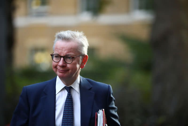 Britain's Chancellor of the Duchy of Lancaster Michael Gove walks outside Downing Street in London