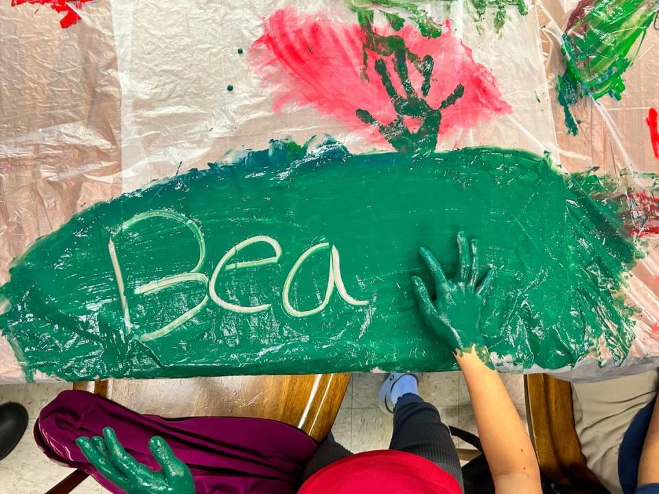 A girl spells out the word “beautiful” in paint during a literacy activity at the afterschool program ourBRIDGE for Kids in Charlotte.