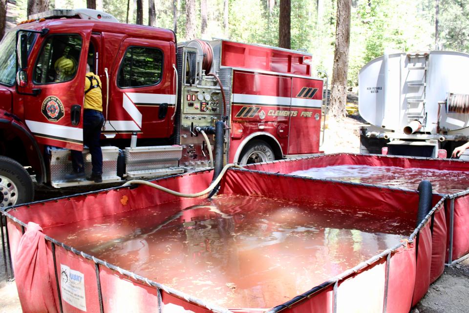 Clements Fire supplies hose line from two portable water tanks during the McKinney Fire in western Siskiyou County.