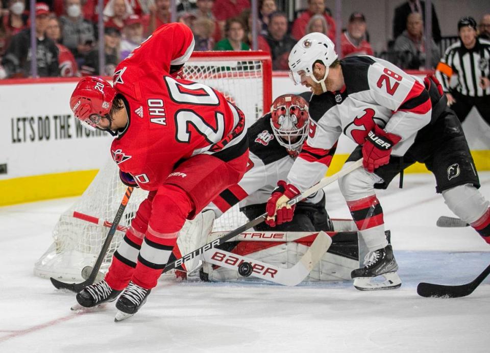 The New Jersey Devils goalie Akira Schmid (40) stops a scoring attempt by the Carolina Hurricanes Sebastian Aho (20) in the first period during Game 5 of their second round Stanley Cup playoff series on Thursday, May 11, 2023 at PNC Arena in Raleigh, N.C.