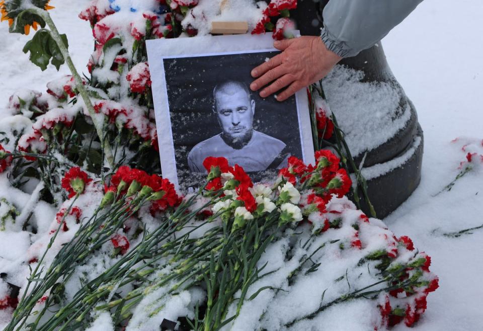 A portrait of Mr Tatarsky, real name Maxim Fomin, near the site of the blast (REUTERS)