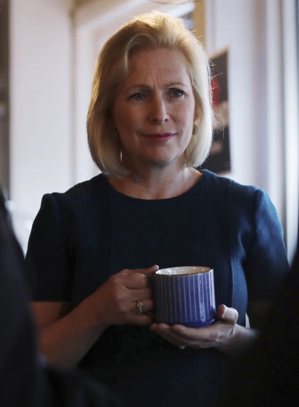 Democratic presidential candidate Sen. Kirsten Gillibrand, D-N.Y., listens to a question during a campaign stop at a coffee shop in Derry, N.H., Friday, May 10, 2019. (AP Photo/Charles Krupa)