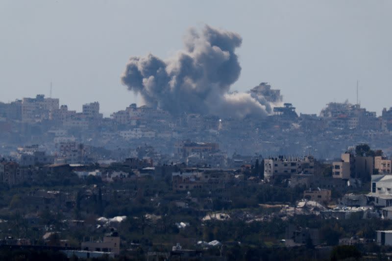 Smoke rises from Gaza during an explosion following an airstrike, as seen from Israel