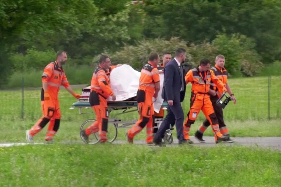 Medical personnel carry Slovakia’s Prime Minister Robert Fico to hospital after being transported in a helicopter, in Banska Bystrica, Slovakia, May 15, 2024 (via REUTERS)