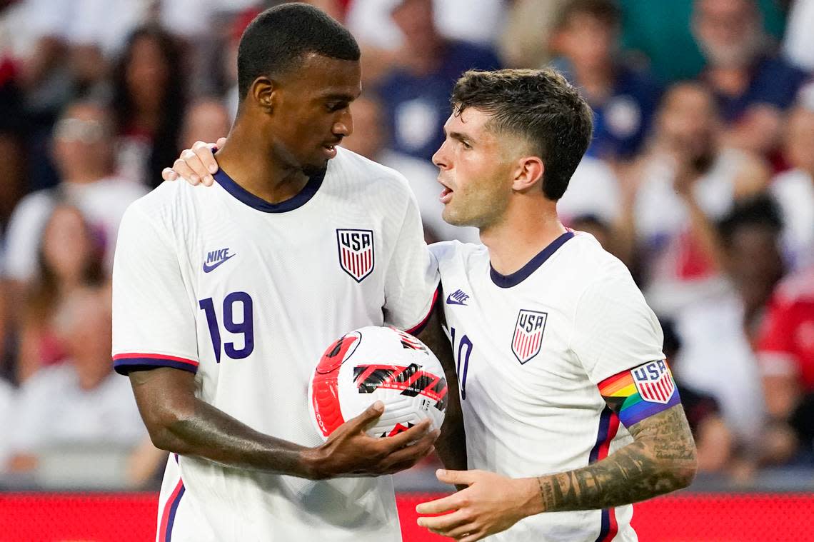 U.S. forward Christian Pulisic, right, hands the ball to Haji Wright (19) during the international friendly soccer match against Morocco on Wednesday, June 1, 2022, in Cincinnati. Tim Ream, Haji Wright, Joe Scally and Sean Johnson made the United States’ World Cup roster.