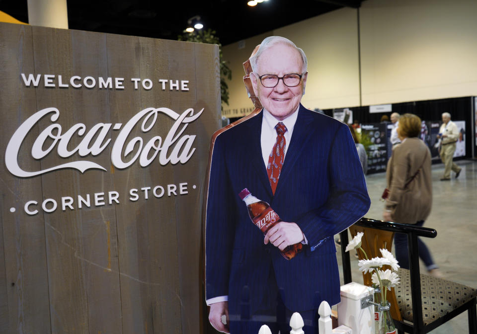 A cutout of Berkshire Hathaway Chairman and CEO Warren Buffett welcomes Berkshire shareholders to the Coca Cola exhibit at the CenturyLink Center in Omaha, Neb., Friday, May 4, 2018, where Berkshire brands display their products and services. On Saturday, shareholders are expected to fill the CenturyLink arena as they attend the annual Berkshire Hathaway shareholders meeting where Buffett and his Vice Chairman Charlie Munger preside over a Q&A session. (AP Photo/Nati Harnik)