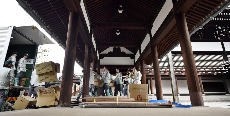 In this Tuesday, Sept. 25, 2018, photo, packs containing parts of Takamikura throne are loaded onto a truck at the Kyoto Imperial Palace in Kyoto, western Japan, to be transported to the Imperial Palace in Tokyo. The special imperial throne for the coronation of Japan’s new emperor arrived in Tokyo on Wednesday, Sept. 26, 2018, from the ancient imperial palace in Kyoto more than a year ahead of time. The Takamikura throne will be used at a ceremony in October 2019 when Crown Prince Naruhito formally announces his succession. (Kyodo News via AP)