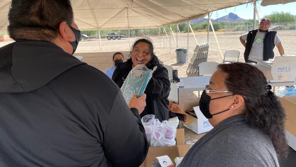 Sells District Administration Office employee Frances Juan, center, helps distribute items to voters on Nov. 8, 2022, at the office on the Tohono O'odham Nation.