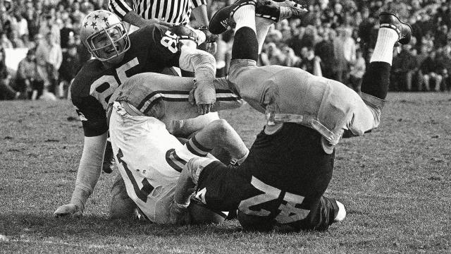 Oakland Raiders quarterback Jim Plunkett (16) prepares to throw