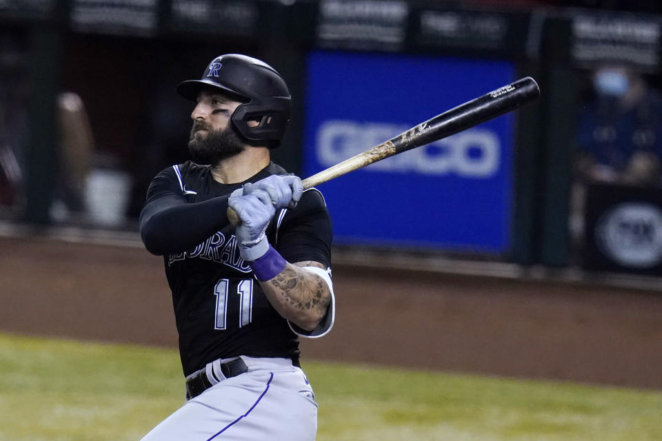 Colorado Rockies' Kevin Pillar watches his three-run double against the Arizona Diamondbacks during the second inning of the second game of a baseball doubleheader Friday, Sept. 25, 2020, in Phoenix. (AP Photo/Ross D. Franklin)