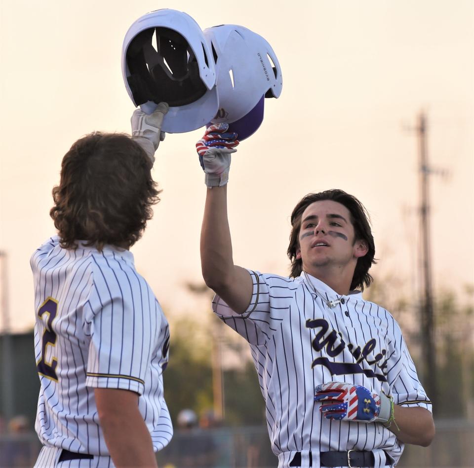 Wylie's Brady Clark, right, celebrates with Hays Sipe after Clark hit a three-run home run in the third inning against Abilene Cooper. Sipe and Sam Walker scored on the blast to give the Bulldogs a 7-1 lead.