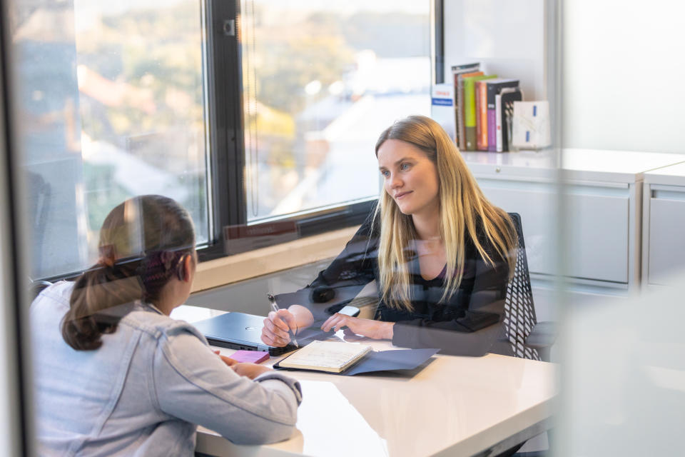 Re-picturing Disability, A group of business women, some with cerebral palsy in an equal opportunities company carrying out the corporate operations of the business, including meetings and discussions, supporting each other through teamwork, encouragement and joint brainstorming,