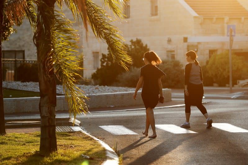 FILE PHOTO: Michele Coven-Wolgel, 60, goes for a walk with her daughter in the Israeli settlement of Maale Adumim in the occupied West Bank