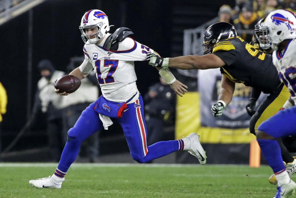 Buffalo Bills quarterback Josh Allen (17) is tackled by Pittsburgh Steelers defensive end Cameron Heyward (97) during the second half of an NFL football game in Pittsburgh, Sunday, Dec. 15, 2019. (AP Photo/Don Wright)