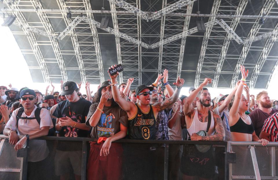 Fans watch J.I.D. perform in the Sahara tent at the Coachella Valley Music and Arts Festival in Indio, Calif., April  16, 2022.