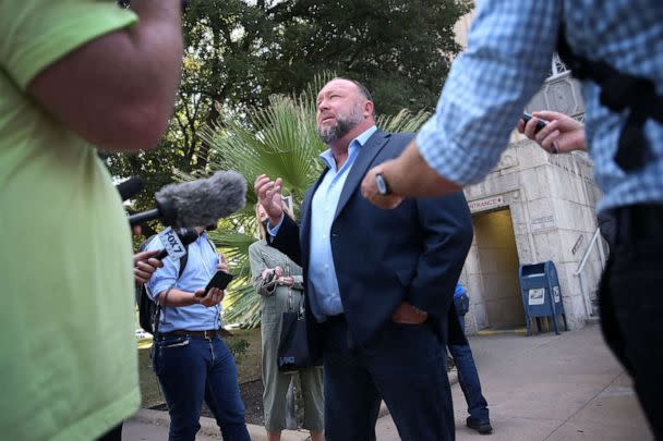 PHOTO: Alex Jones steps outside of the Travis County Courthouse, to do interviews with media after he was questioned under oath about text messages and emails by lawyer Mark Bankston, in Austin, Texas, Aug. 3, 2022. (Briana Sanchez/Pool via Reuters)