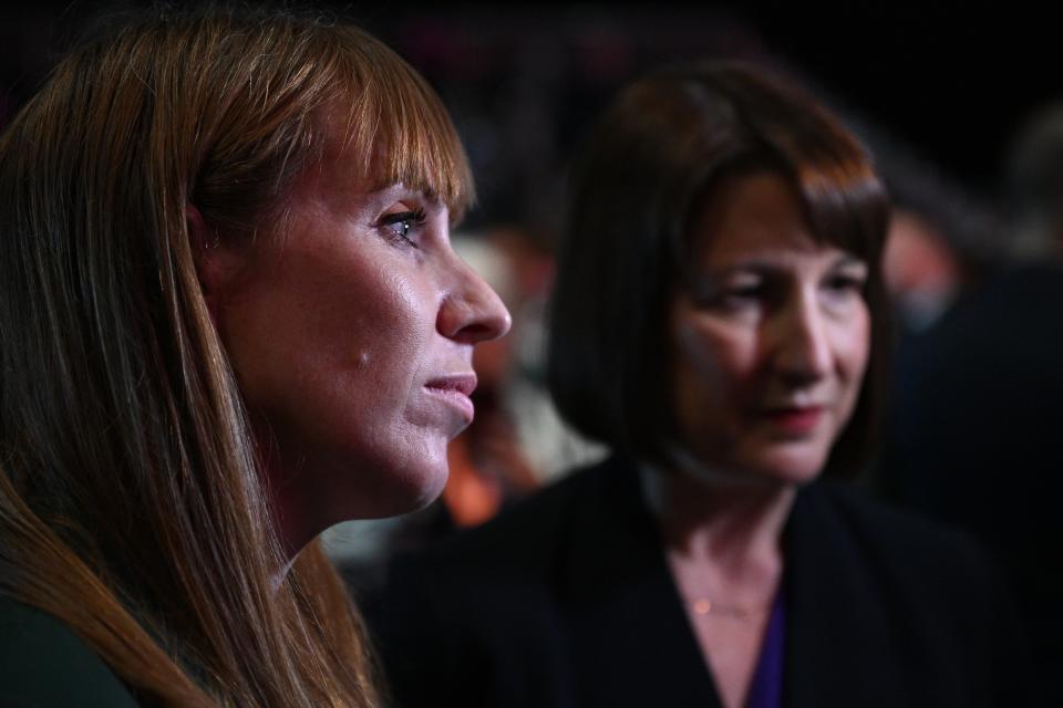 Chancellor of the Exchequer Rachel Reeves (R) and Britain's Deputy Prime Minister and Levelling Up, Housing and Communities Secretary Angela Rayner (L) speak during an interview with a TV journalist after Keir Starmer’s speech (AFP via Getty Images)