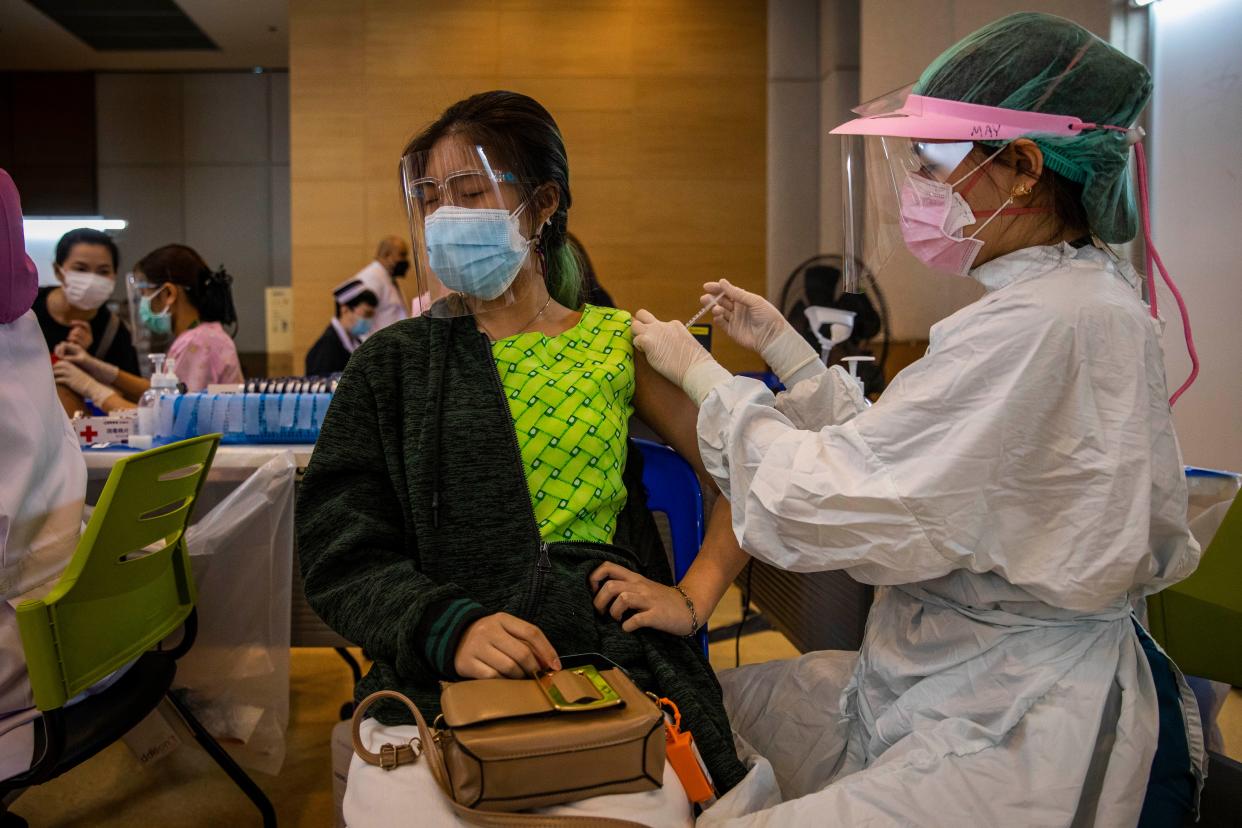 Thai teenagers receive their first dose of the Pfizer COVID-19 vaccine at Vachira Hospital on Sept. 21, 2021, in Bangkok, Thailand. Thailand began vaccinating 12-18-year-old students, prioritizing those with pre-existing conditions, ahead of in-person school reopening this fall. Thousands of students signed up through the Bangkok Metropolitan Administration, with the consent of their parents, to be vaccinated with the Pfizer-BioNTech COVID-19 vaccine.