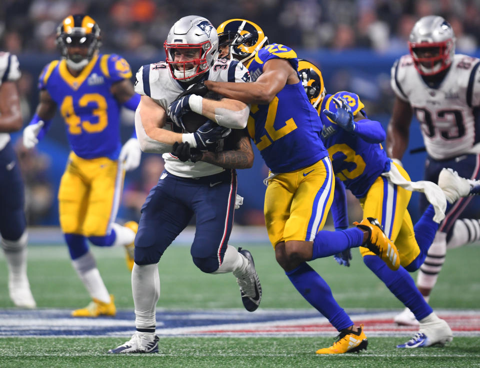 Feb 3, 2019; Atlanta, GA, USA; New England Patriots running back Rex Burkhead (34) is tackled by <a class="link " href="https://sports.yahoo.com/nfl/teams/la-rams/" data-i13n="sec:content-canvas;subsec:anchor_text;elm:context_link" data-ylk="slk:Los Angeles Rams;sec:content-canvas;subsec:anchor_text;elm:context_link;itc:0">Los Angeles Rams</a> cornerback <a class="link " href="https://sports.yahoo.com/nfl/players/28406/" data-i13n="sec:content-canvas;subsec:anchor_text;elm:context_link" data-ylk="slk:Marcus Peters;sec:content-canvas;subsec:anchor_text;elm:context_link;itc:0">Marcus Peters</a> (22) during the fourth quarterin Super Bowl LIII at Mercedes-Benz Stadium. Mandatory Credit: Christopher Hanewinckel-USA TODAY Sports