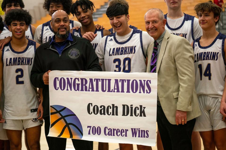 Fort Collins High School boys basketball head coach Bruce Dick is honored for his 700th career win during a basketball doubleheader in Fort Collins on Saturday.