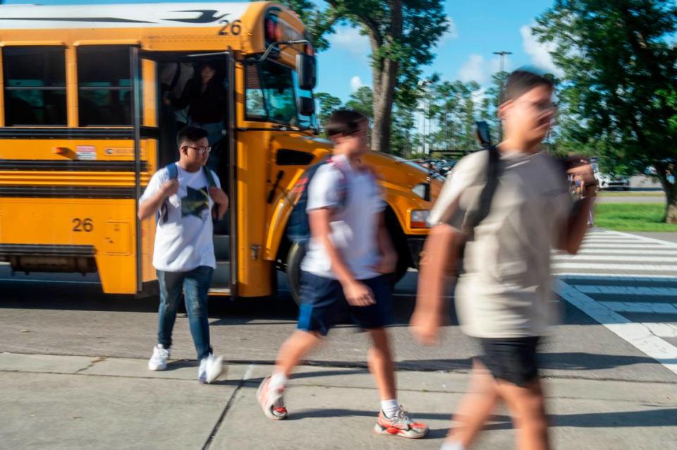 High school students are let off the bus for their first day of classes at Ocean Springs High School in Ocean Springs on Friday, Aug. 5, 2022.