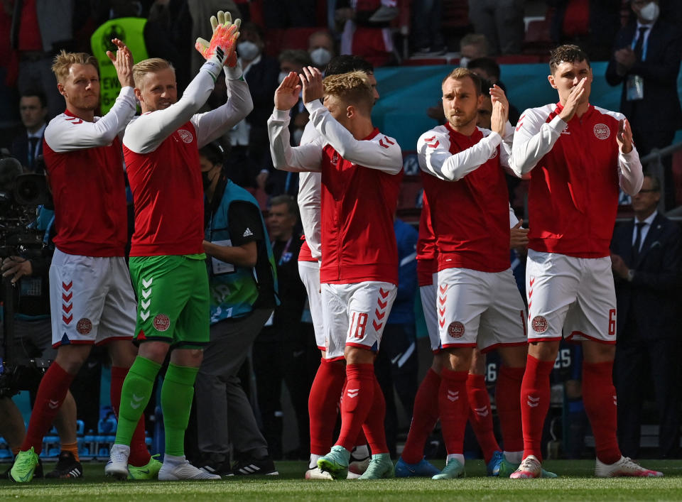 Denmark's midfielder Christian Eriksen (2R) applauds with teammates before the UEFA EURO 2020 Group B football match between Denmark and Finland at the Parken Stadium in Copenhagen on June 12, 2021. (Photo by Jonathan NACKSTRAND / POOL / AFP) (Photo by JONATHAN NACKSTRAND/POOL/AFP via Getty Images)