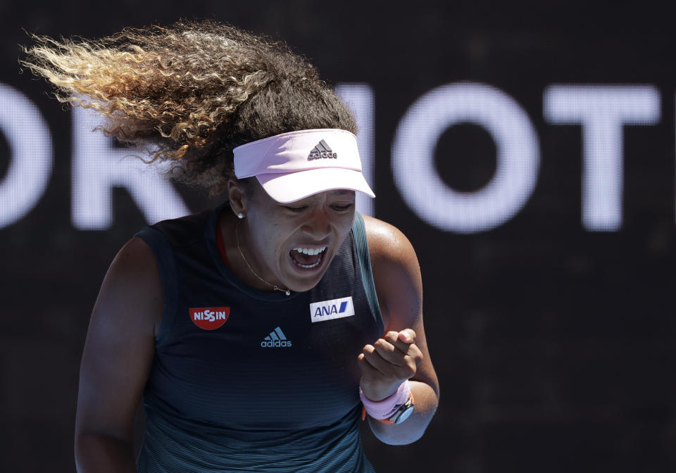 Japan's Naomi Osaka reacts after winning a point against Taiwan's Hsieh Su-Wei during their third round match at the Australian Open tennis championships in Melbourne, Australia, Saturday, Jan. 19, 2019. (AP Photo/Kin Cheung)