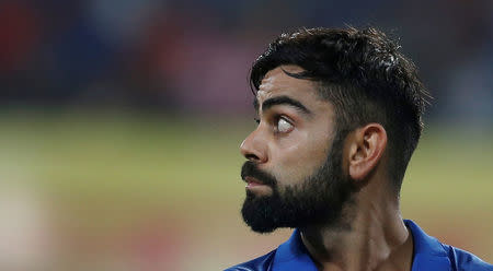 Cricket - India v Australia - Third One Day International Match - Indore, India – September 24, 2017 – India's captain Virat Kohli walks off the field after his dismissal. REUTERS/Adnan Abidi