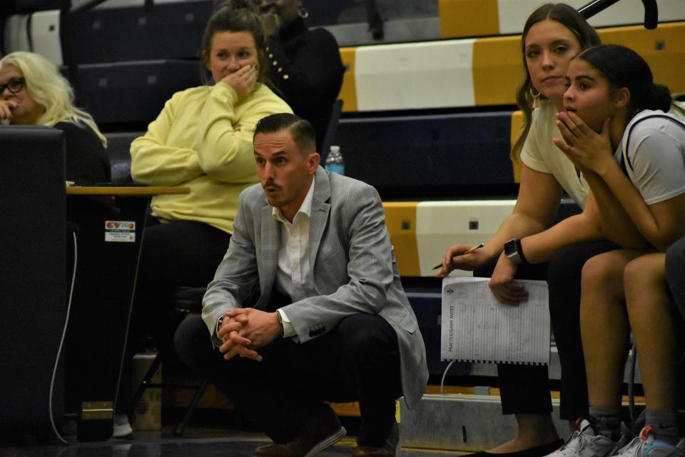 Battle head coach Dustyn Yung looks on nervously during the final seconds of the Spartans' win over Rock Bridge on Dec. 6, 2022, at Battle High School in Columbia, Mo.