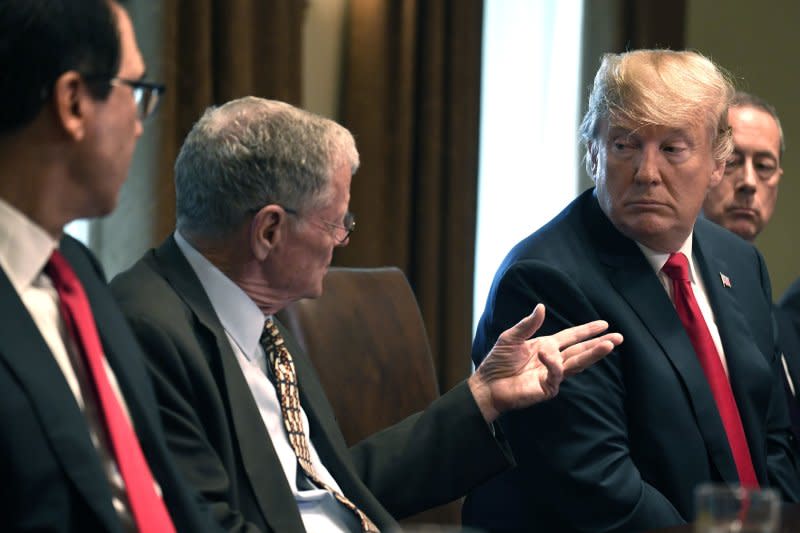 President Donald Trump (R) listens to remarks by Sen. Jim Inhofe, R-Okla., during a meeting with members of Congress at the White House on June 20, 2018. File Photo by Mike Theiler/UPI