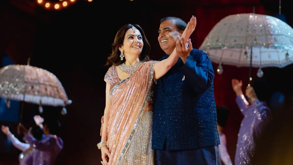 Nita and Mukesh Ambani, the mother and father of the groom, pictured at a pre-wedding celebration. - Courtesy Manish Malhotra