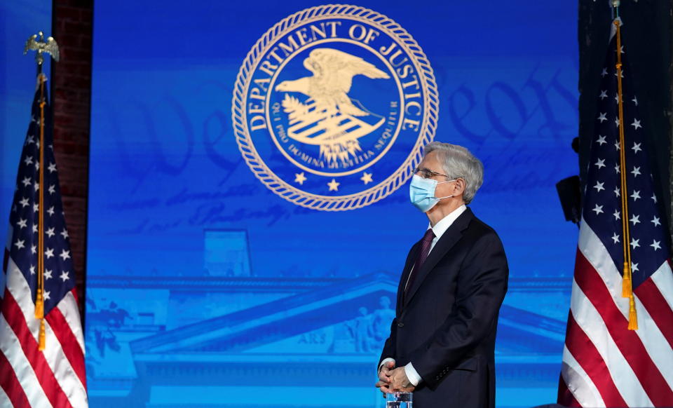 Judge Merrick Garland, U.S. President-elect Joe Biden's nominee to be U.S. Attorney General, rises to speak as Biden announces his Justice Department nominees at his transition headquarters in Wilmington, Delaware, U.S., January 7, 2021. REUTERS/Kevin Lamarque