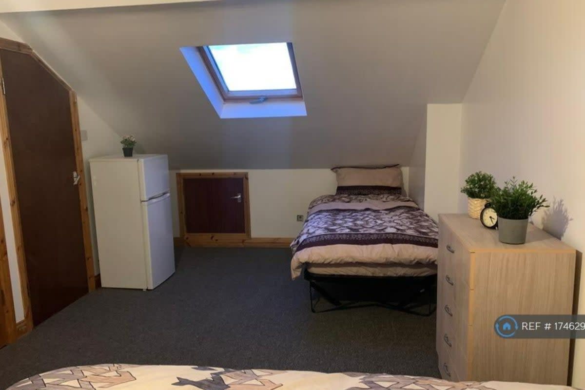 Cramped: the skylight gives some standing room but what is through the tiny door at the back? (OpenRent / Rightmove)