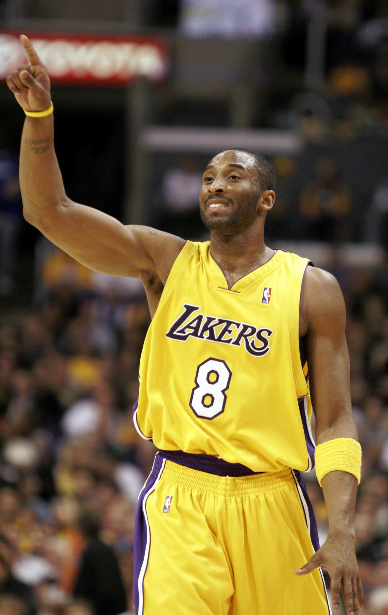 Los Angeles Lakers Kobe Bryant directs his team during the first half against the Detroit Pistons in Los Angeles on Friday, Feb. 25, 2005.