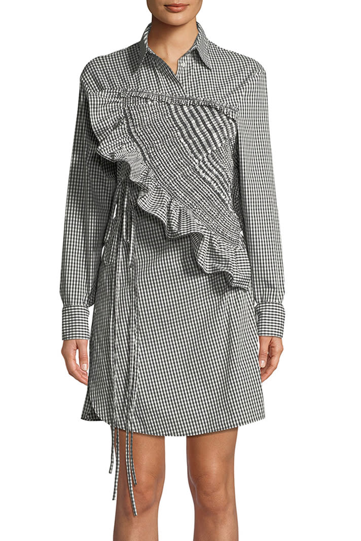 From the chest up, this shirtdress looks totally standard. But that's about the only part of it that does. <em>3.1 Phillip Lim ruffled gingham shirt dress, $550 at <a href="https://www.bergdorfgoodman.com/31-Phillip-Lim-Ruffled-Long-Sleeve-Gingham-Shirtdress/prod138342493/p.prod" rel="nofollow noopener" target="_blank" data-ylk="slk:Bergdorf Goodman;elm:context_link;itc:0;sec:content-canvas" class="link ">Bergdorf Goodman</a></em>