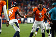 Denver Broncos wide receiver Seth Williams (19) celebrates his touchdown catch against the Dallas Cowboys with teammate Russell Wilson during the first half of an NFL preseason football game, Saturday, Aug. 13, 2022, in Denver. (AP Photo/Jack Dempsey)