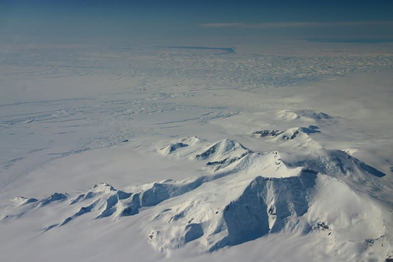 Part of the eastern flank of Crosson Ice Shelf (C-L) and Mount Murphy (foreground) as viewed during a NASA IceBridge flight on October 23, 2012, with Thwaites Ice Shelf beyond the highly fractured expanse of ice