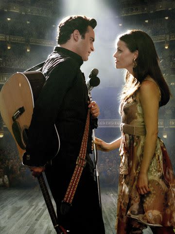 <p>RGR Collection / Alamy</p> Joaquin Phoenix as Johnny Cash and Reese Witherspoon as June Carter Cash in 'Walk the Line'.