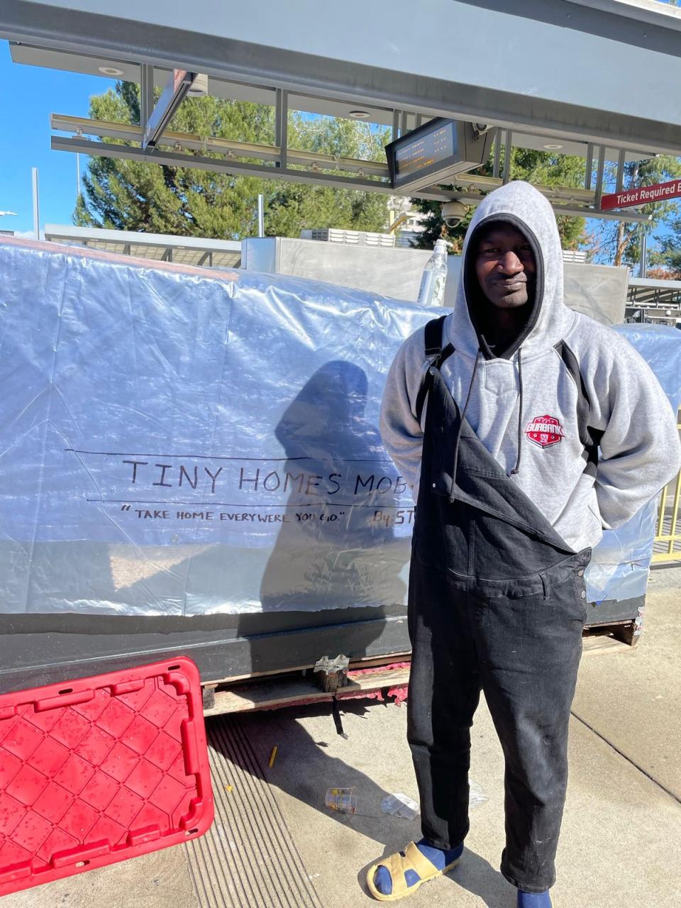 Ron, 37, a ‘builder extraordinaire’ built a makeshift shelter on wheels to last out the storm (Mike Bedigan/ The Independent)