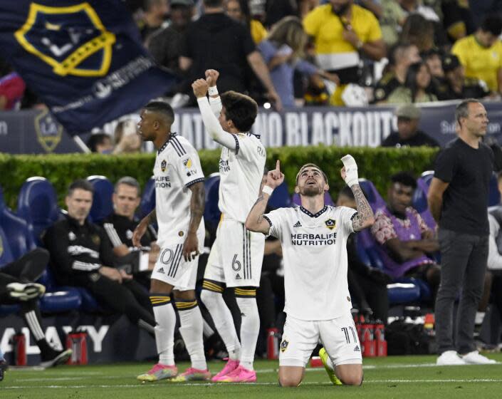 PASADENA, CA - JULY 04: LA Galaxy midfielder Tyler Boyd, right, celebrates after scoring a goal against Los Angeles FC during the first half of a MLS soccer match at Rose Bowl Stadium on Tuesday, July 4, 2023 in Pasadena, CA. (Alex Gallardo/For the Times)