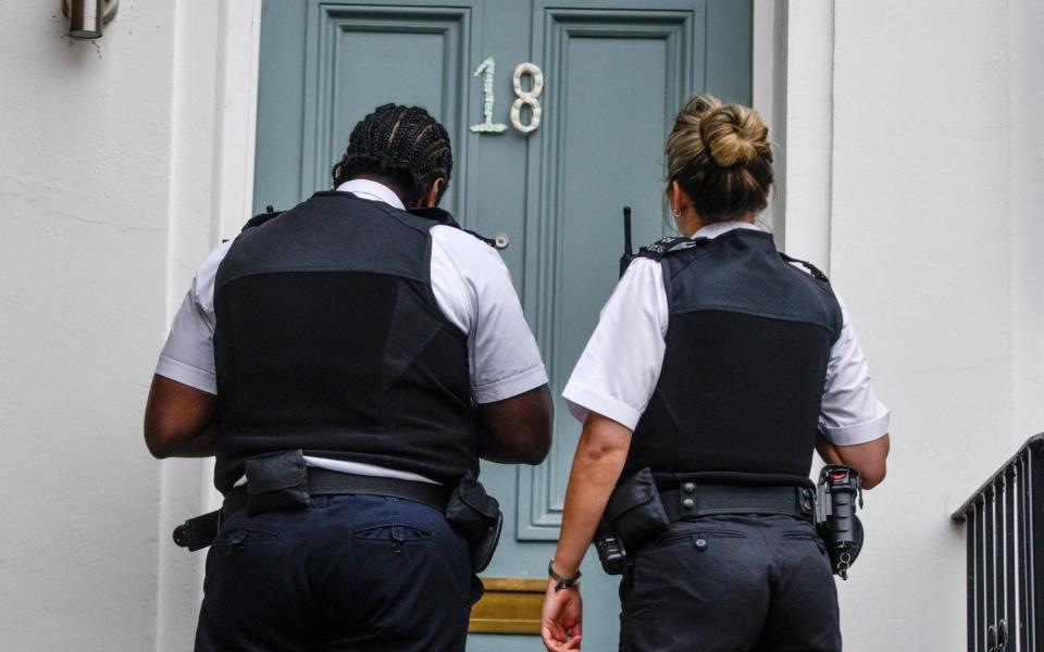 Police at Dominic Cummings' front door - GETTY IMAGES