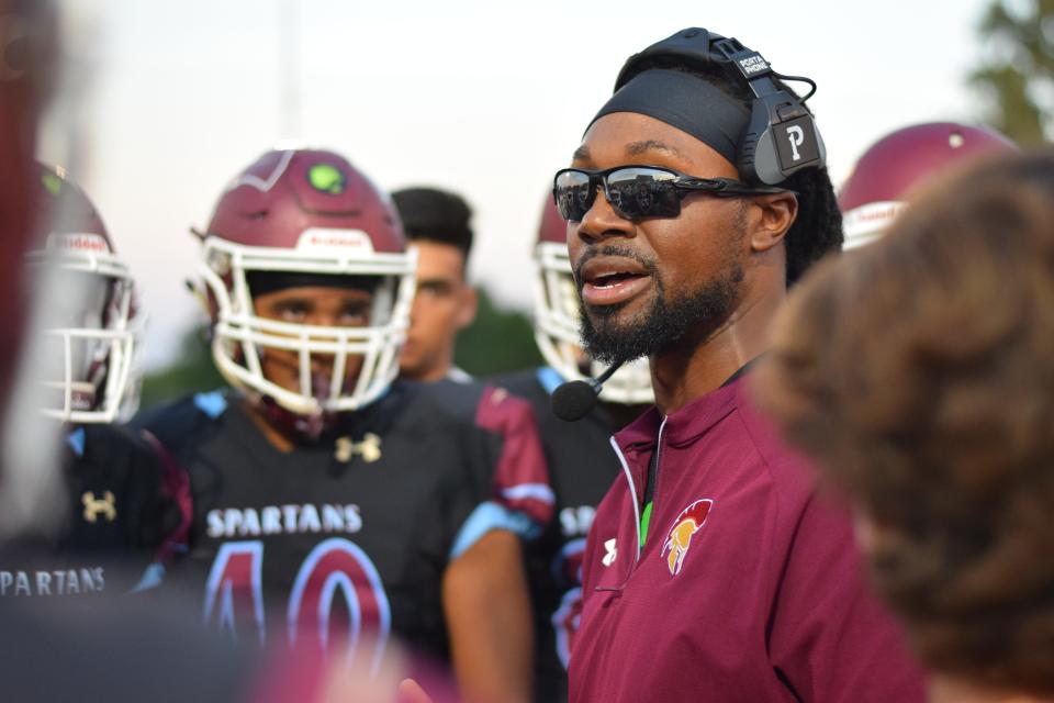 Former DeSmet High School football coach Robert Steeples speaking to his team before a game on Sept. 13, 2019.