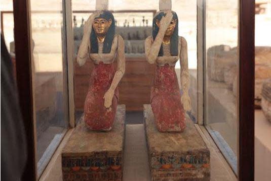 Two wooden statues are seen on display at the Saqqara Necropolis near Cairo, in Egypt, in a photo provided by the Egyptian Ministry of Antiquities, May 30, 2022.  / Credit: Egyptian Ministry of Tourism and Antiquities